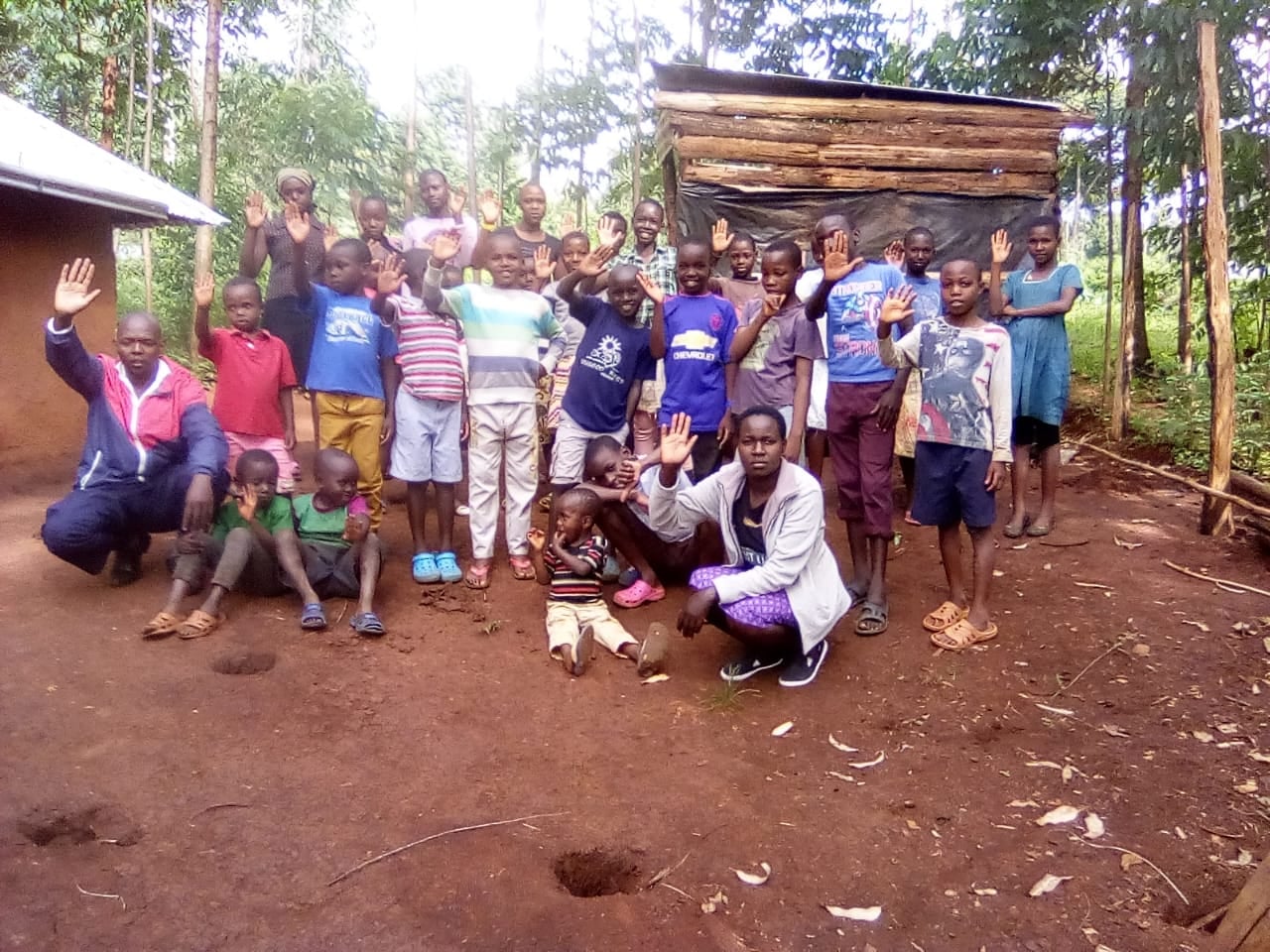Village children waving near Seya Light, 2018.
