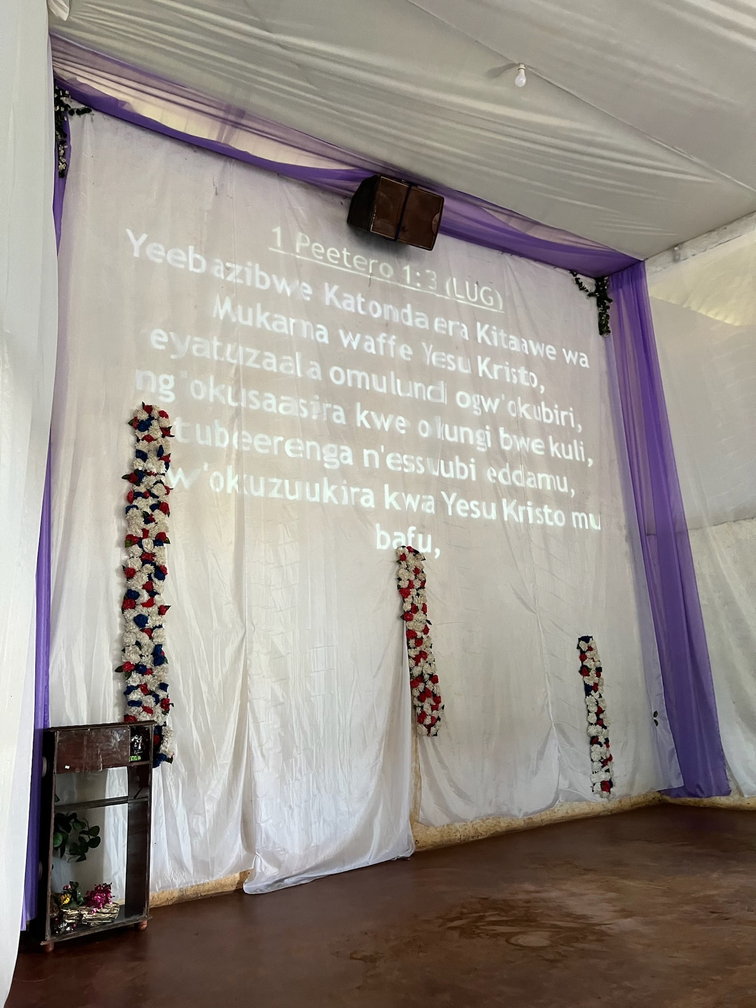 1 Peter in Luganda on the screen, 2024.