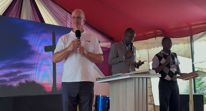 Mark and Pastor Maurice on stage, 2026.