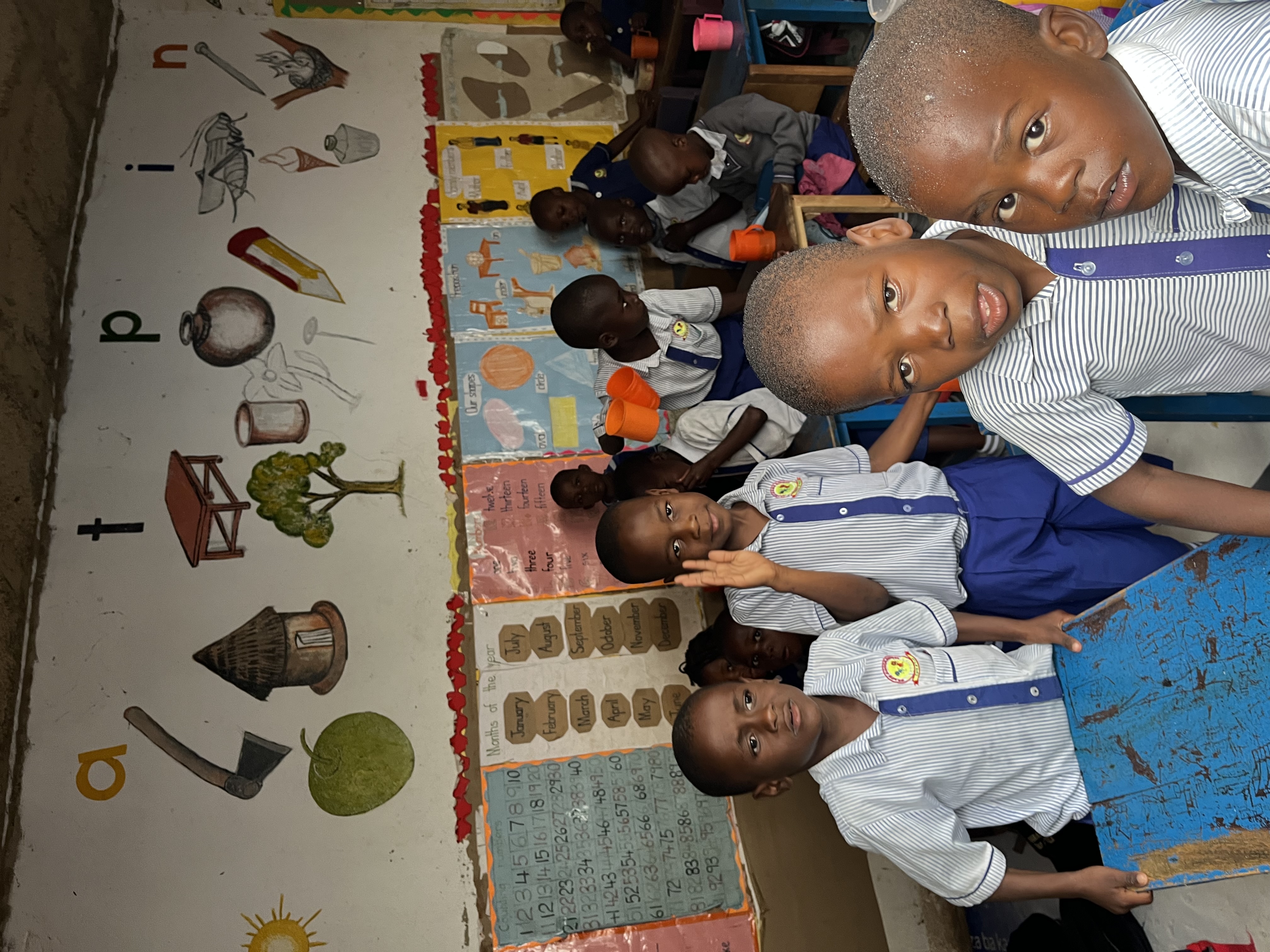 Students in a Grace Junior School classroom with wall mural.