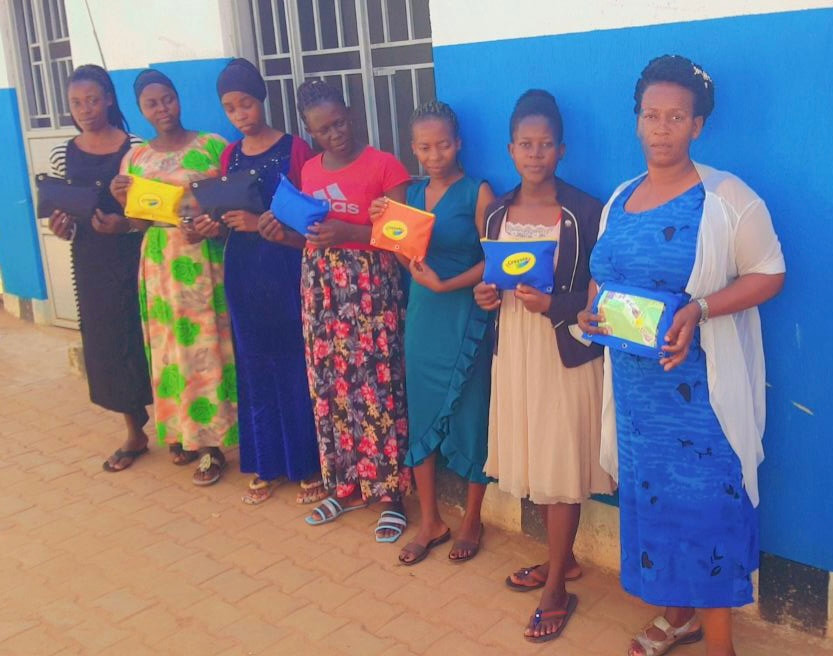 Grace Junior School teachers receiving pouches and gifts.