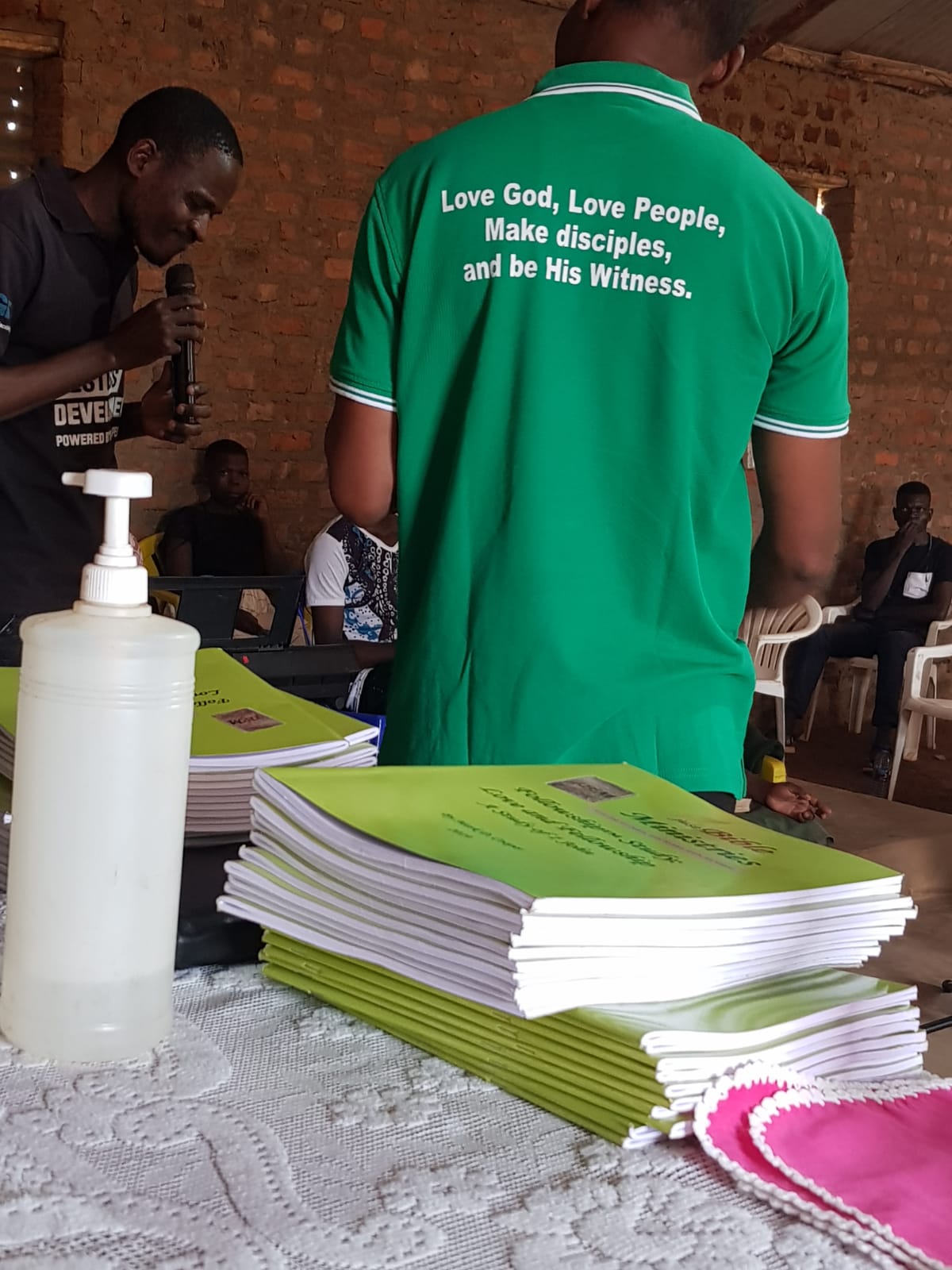Stacks of 1 John fellowship-study workbooks ready to be handed out.