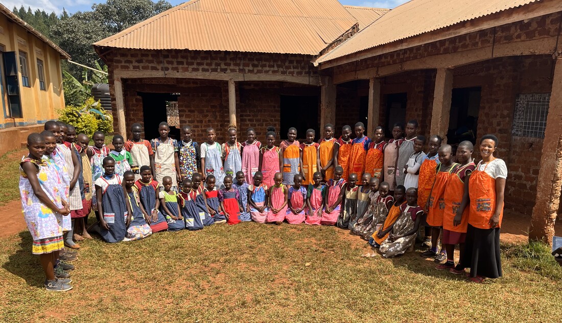 Seya Light students with gifts and school supplies.