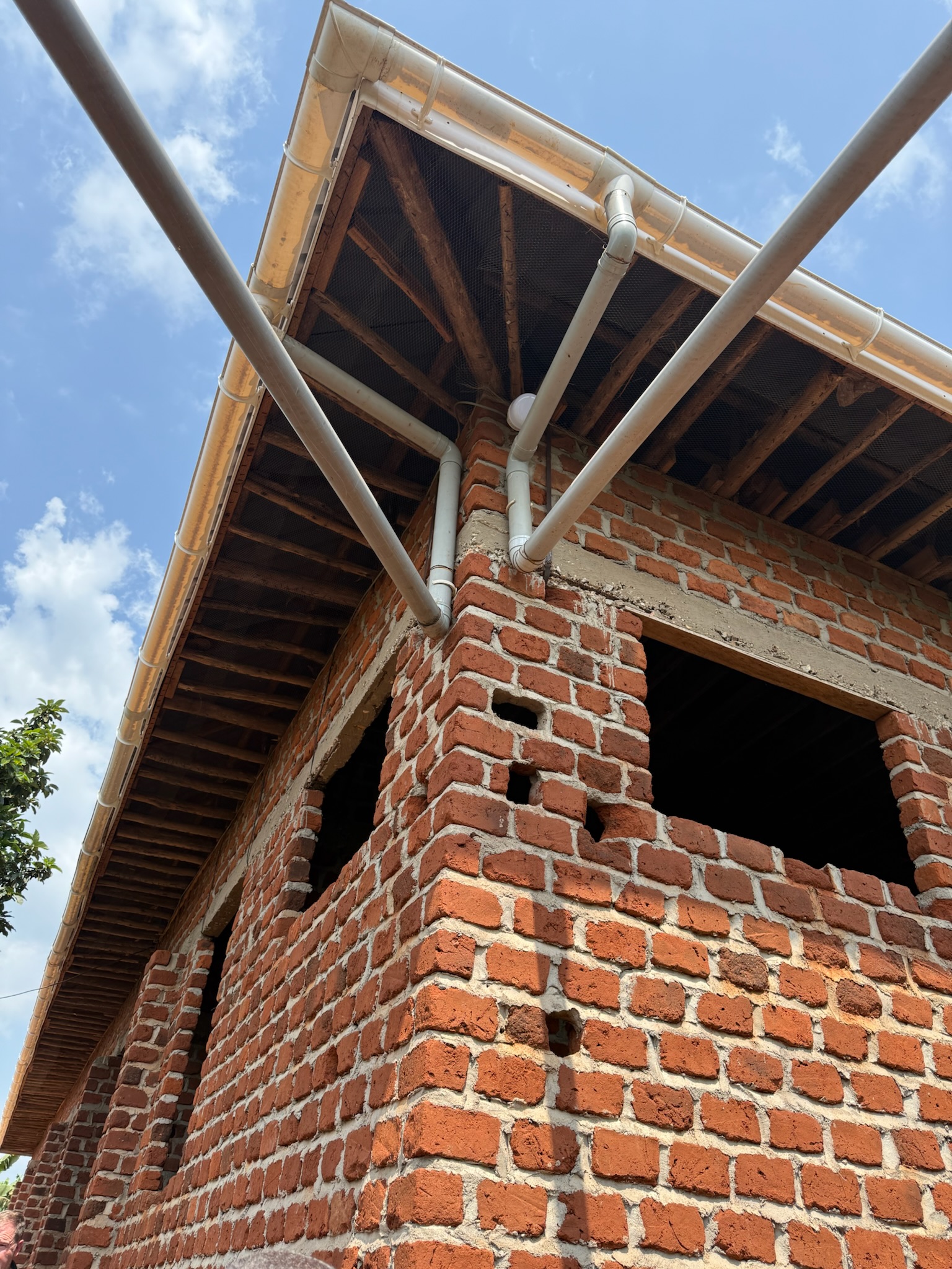 Gutter and plumbing pipes on the VHC girls' dormitory, 2025.