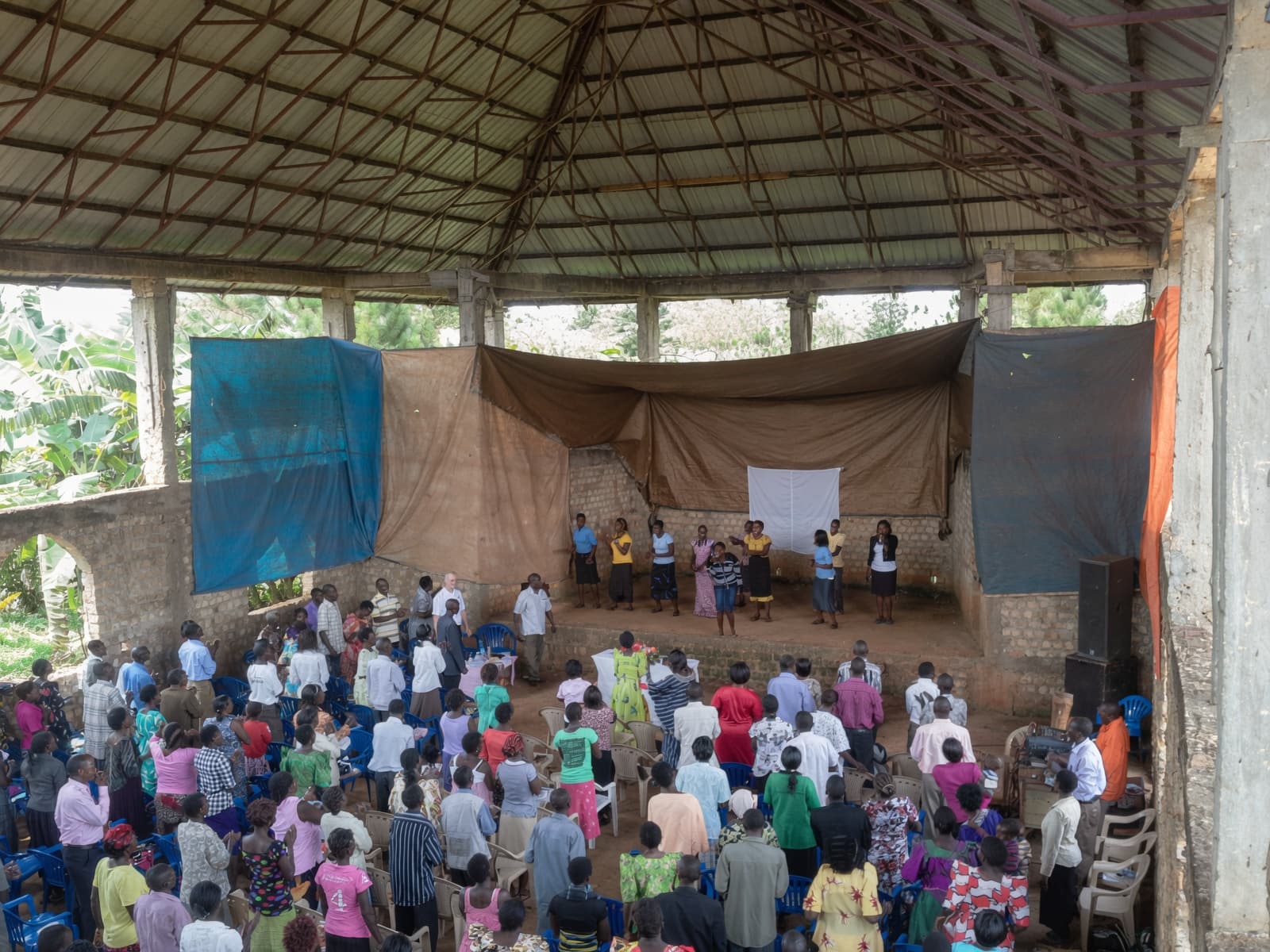 Congregation worshipping in the unfinished brick hall, 2014.