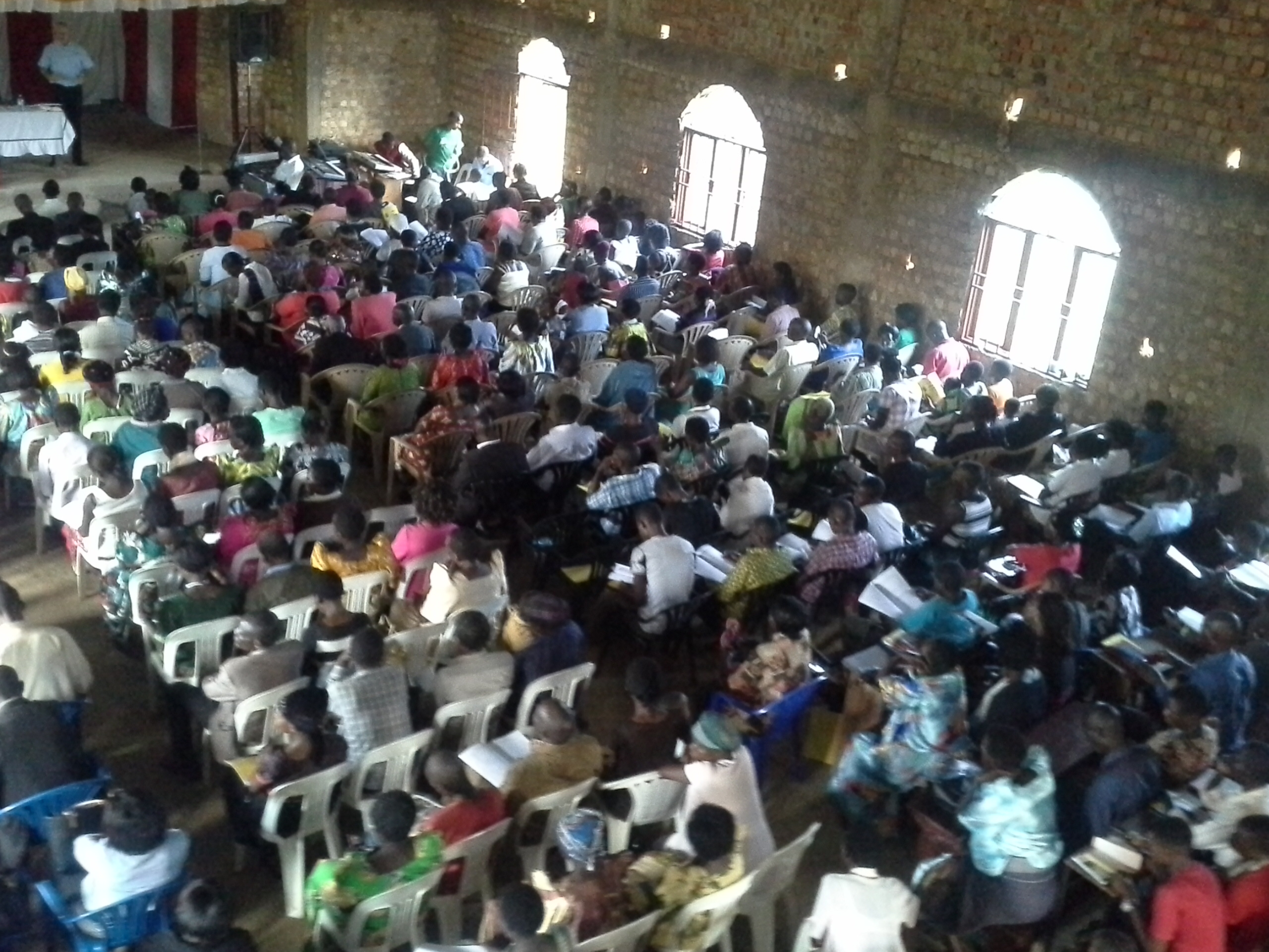 4th Symposium packed in the brick hall.