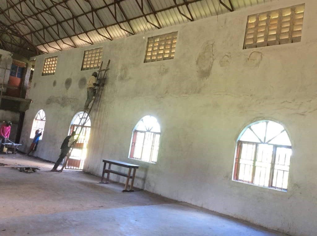 Plastering on a ladder at Zion, 2020.
